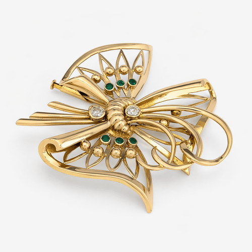 Broche Broche nœud stylisé en or jaune 18 carats, diamants et émeraudes 58 Facettes 36314