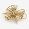 Broche Broche nœud stylisé en or jaune 18 carats, diamants et émeraudes 58 Facettes 36314