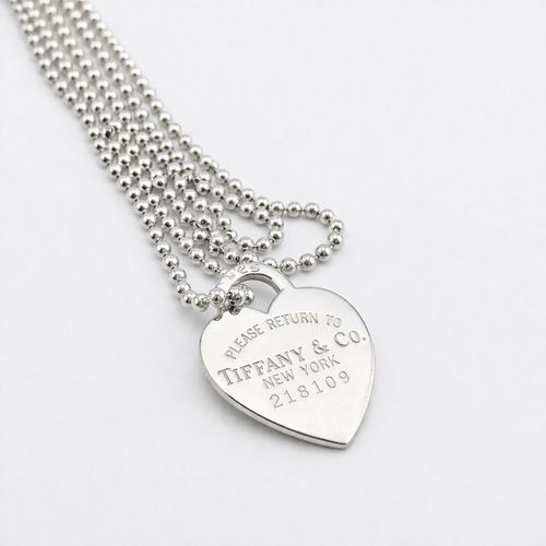 Collier Tiffany & Co. - Collier à pendentif cœur en argent 925 58 Facettes 36236