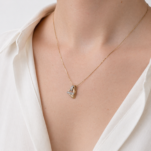 Pendentif Guy Laroche - Pendentif géométrique en trois ors 18 carats et diamants 58 Facettes 36364