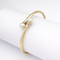 Bracelet Bracelet jonc ouvert en or jaune 18 carats et perles 58 Facettes 36269
