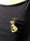 Broche Broche écureuil articulée en or champagne et rubis synthétiques 58 Facettes id: 1755465