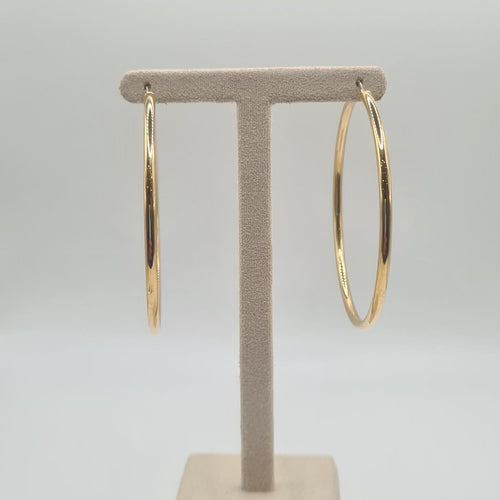 Boucles d'oreilles Boucles d'oreilles créoles en or jaune 18 carats 58 Facettes #BT