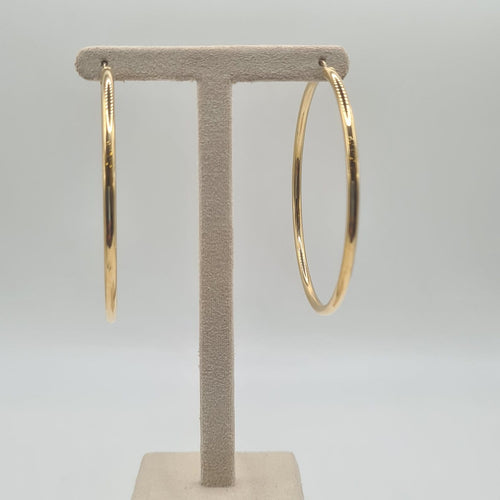 Boucles d'oreilles Boucles d'oreilles créoles en or jaune 18 carats 58 Facettes #BT