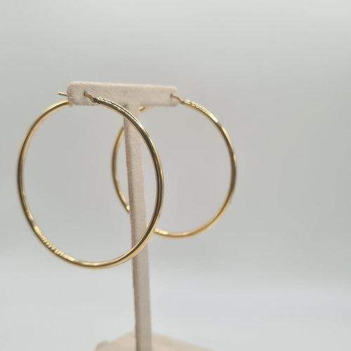 Boucles d'oreilles Boucles d'oreilles créoles en or jaune 18 carats 58 Facettes #BT