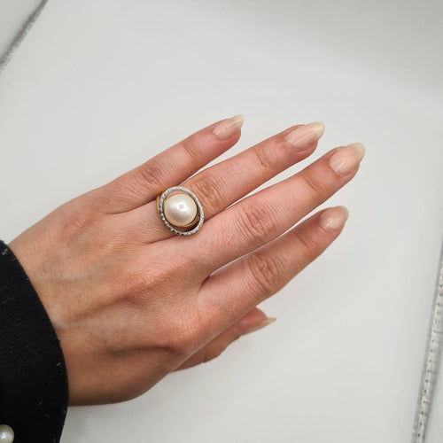 Bague 50 Bague en or jaune 18k avec perle de culture et diamants 58 Facettes #BT