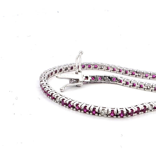Bracelet Bracelet tennis en or blanc 18 kt avec rubis et diamants 58 Facettes 236 OC