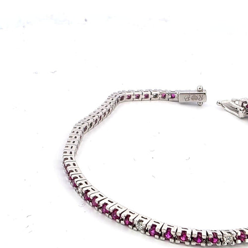 Bracelet Bracelet tennis en or blanc 18 kt avec rubis et diamants 58 Facettes 236 OC