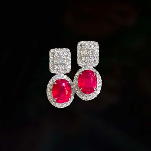 Boucles d'oreilles Boucles d'oreilles en or blanc 18 carats, rubis et diamants 58 Facettes GER1014RD