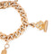 Bracelet Bracelet - Maillon gourmette en or rose 18k avec 4 breloques 58 Facettes 1