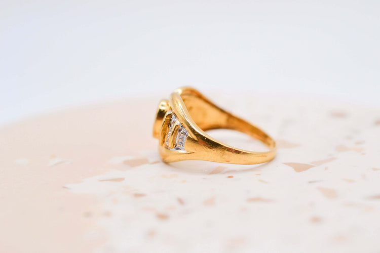 Bague 50 Bague nœud en or jaune, émeraude et diamants 58 Facettes 3988