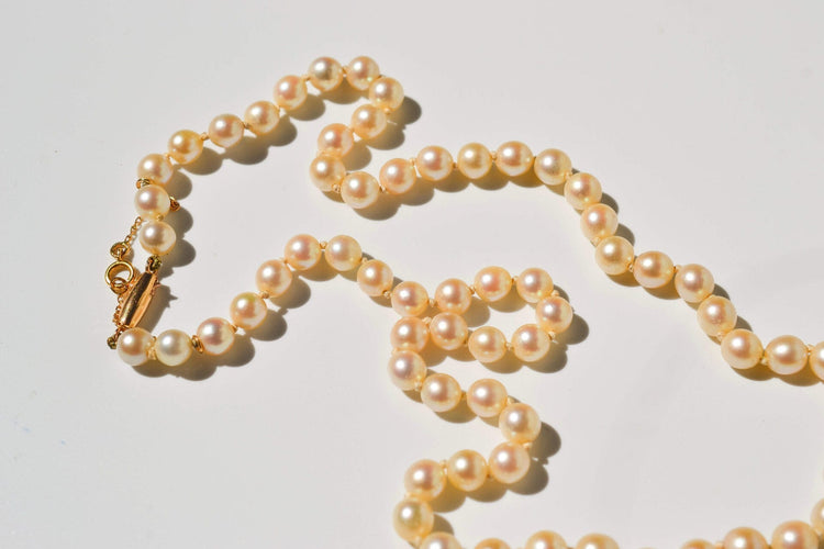 Collier Collier en or jaune 18 carats et perles de culture 58 Facettes 4011