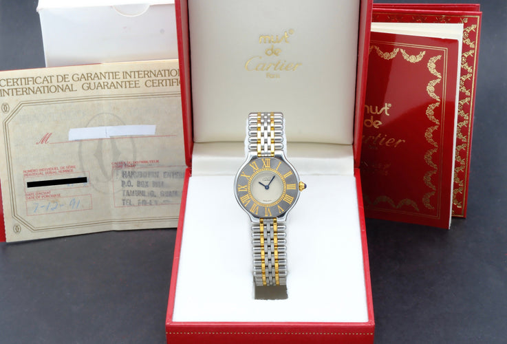 Montre Cartier 21 Must de Cartier - Montre quartz en or et acier 58 Facettes CRT/MST/012