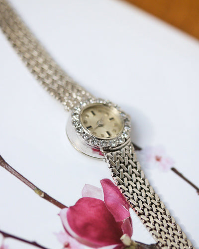 Montre Montre 1950 en or blanc et diamants 58 Facettes A12071
