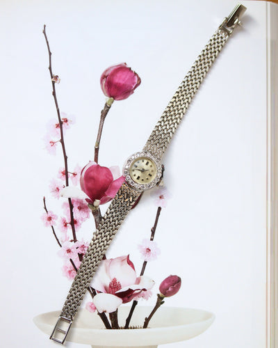 Montre Montre 1950 en or blanc et diamants 58 Facettes A12071