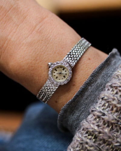 Montre Montre 1950 en or blanc et diamants 58 Facettes A12071