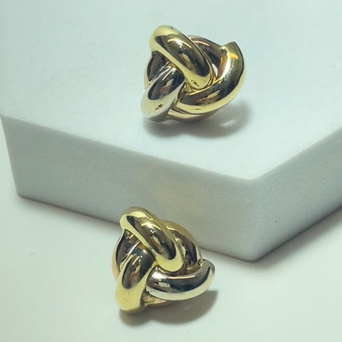 Boucles d'oreilles entrelacées en or jaune 18 carats 58 Facettes 260055