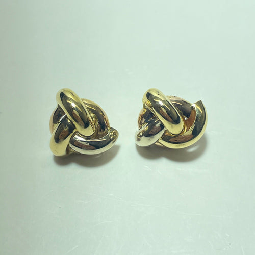 Boucles d'oreilles entrelacées en or jaune 18 carats 58 Facettes 260055
