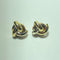 Boucles d'oreilles entrelacées en or jaune 18 carats 58 Facettes 260055