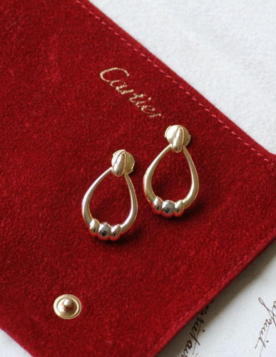 Boucles d'oreilles Cartier Trinity - Boucles d'oreilles pendantes en trois ors 58 Facettes