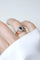 Bague 61 Bague marguerite ancienne en or rose, platine, saphir et diamants 58 Facettes