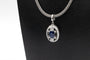 Collier Collier contemporain en platine, or blanc, saphir et diamants 58 Facettes 12159