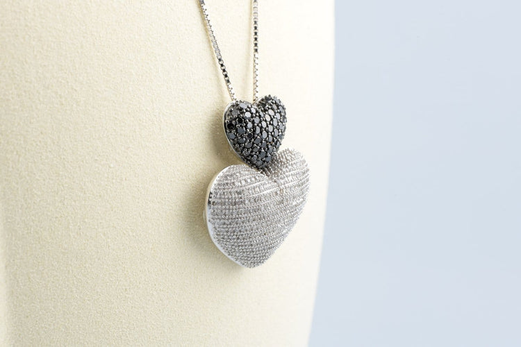 Collier Collier double cœur en or blanc 18K et diamants 58 Facettes CLDIAMBLACK-107