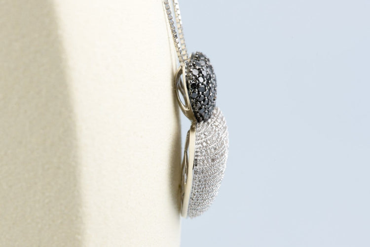 Collier Collier double cœur en or blanc 18K et diamants 58 Facettes CLDIAMBLACK-107