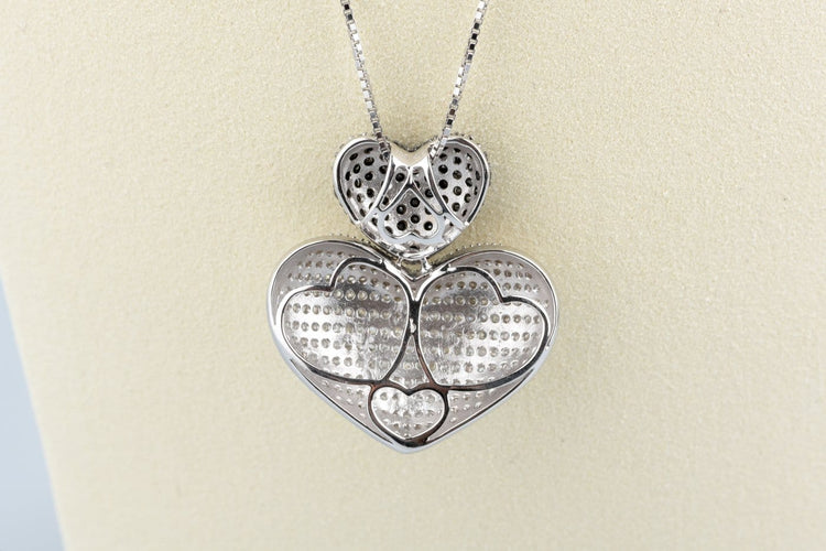 Collier Collier double cœur en or blanc 18K et diamants 58 Facettes CLDIAMBLACK-107