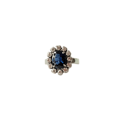 Bague 50 Bague marguerite vers 1960 en or blanc, saphir et diamants 58 Facettes