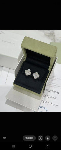 Boucles d'oreilles Van Cleef & Arpels Vintage Alhambra - Boucles d’oreilles en or blanc et diamants 58 Facettes Jnci45