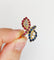 Bague 52.5 Bague marquise moderniste en or 18k, diamants, rubis et saphirs 58 Facettes A07270