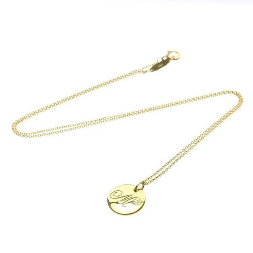 Collier Tiffany & Co. - Collier pendentif Letter Disc en or jaune 18K 58 Facettes tvg2iyp7ie