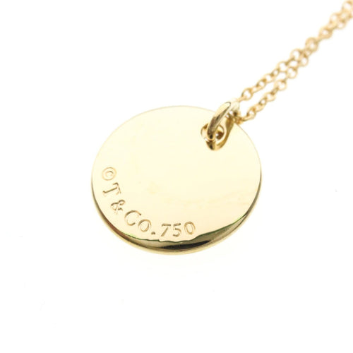Collier Tiffany & Co. - Collier pendentif Letter Disc en or jaune 18K 58 Facettes tvg2iyp7ie
