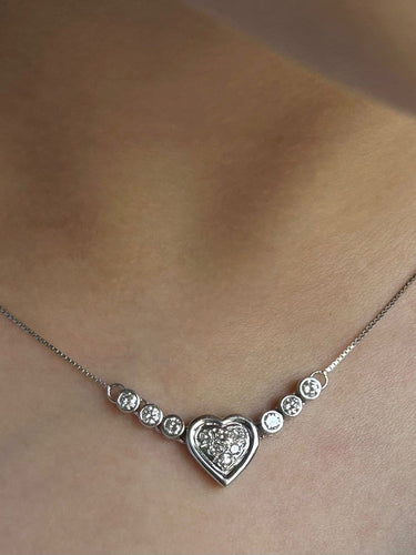 Collier Collier cœur en or blanc 18K et diamants 58 Facettes 269