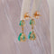 Boucles d'oreilles Boucles d'oreilles pendantes en or jaune 14 ct, émeraudes et diamants 58 Facettes E015