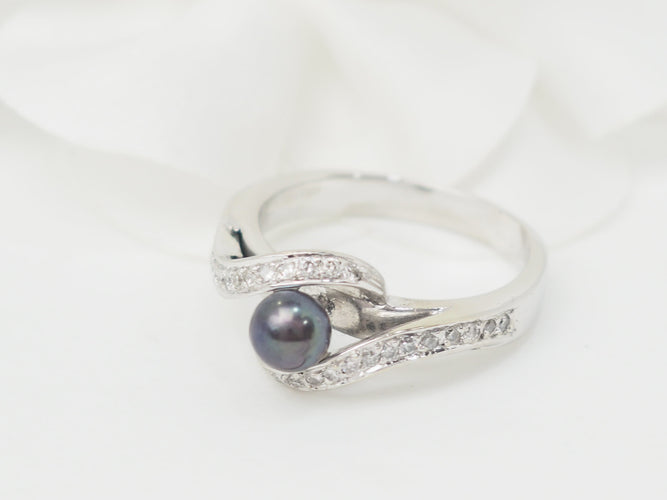 Bague 60 Bague en or blanc, perle de Tahiti et diamants 58 Facettes 26570