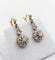 Boucles d'oreilles Dormeuses marguerite - Boucles d'oreilles en or 18k, platine et diamants 58 Facettes A07334