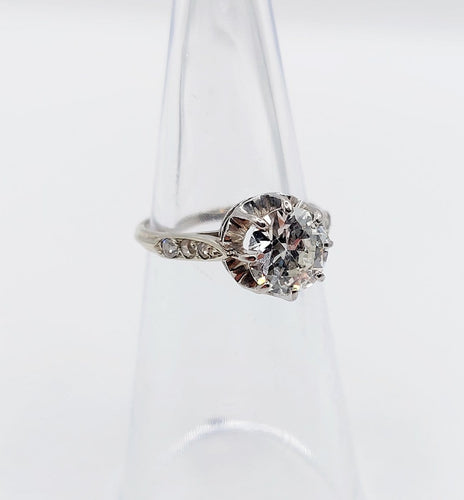 Bague 47 Bague solitaire Art déco en or blanc, platine et diamants 58 Facettes A07288