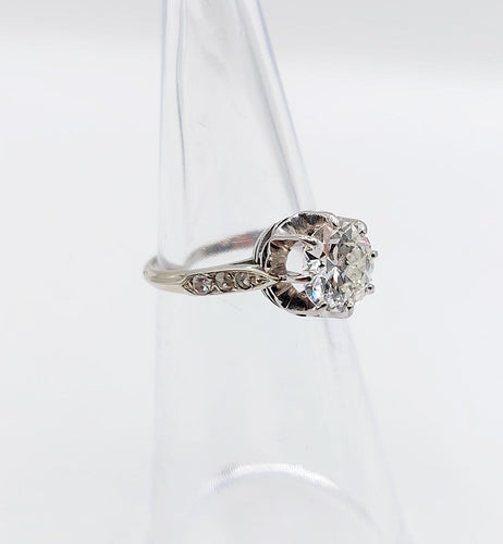 Bague 47 Bague solitaire Art déco en or blanc, platine et diamants 58 Facettes A07288