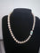 Collier Akoya - Collier 49 perles, fermoir platine, émeraude et diamants 58 Facettes 948