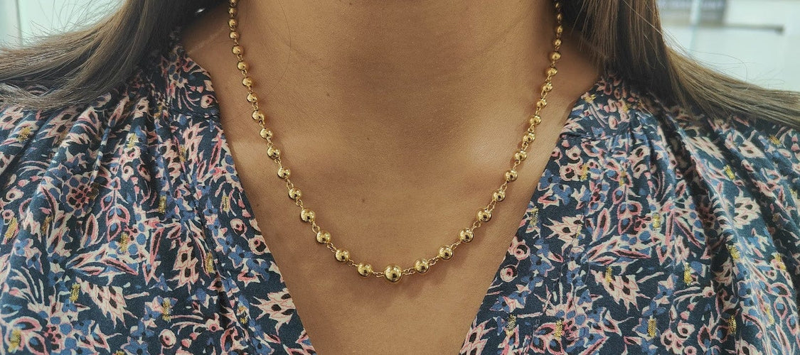 Collier Collier marseillais en or jaune 18 carats à boules dégradées 58 Facettes 33780