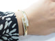 Bracelet Bracelet jonc ouvrant en or jaune et diamants 58 Facettes 33362