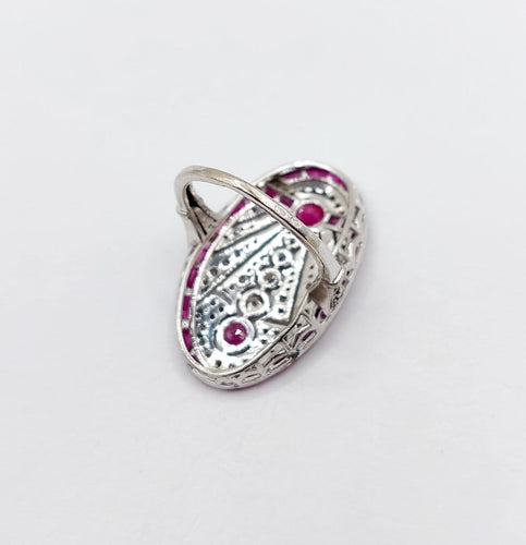 Bague 48 Bague marquise Art déco en or blanc 18k, rubis et diamants 58 Facettes A07360