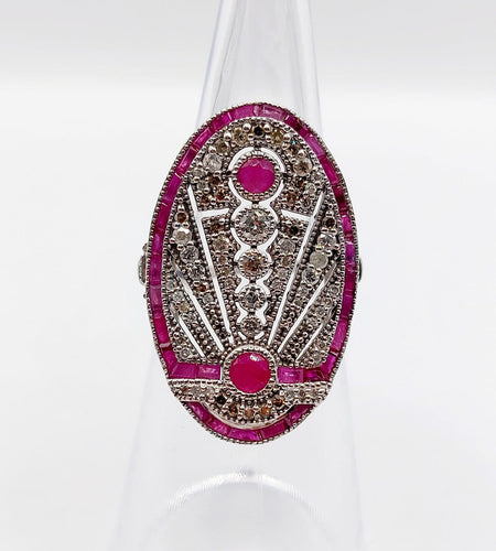 Bague 48 Bague marquise Art déco en or blanc 18k, rubis et diamants 58 Facettes A07360