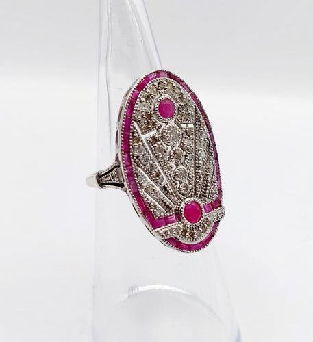 Bague 48 Bague marquise Art déco en or blanc 18k, rubis et diamants 58 Facettes A07360