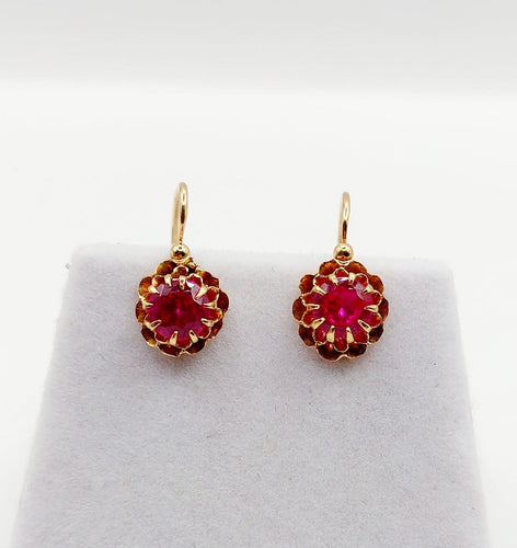 Boucles d'oreilles Dormeuses antiques circa 1900 en or rose 18k et rubis synthétiques 58 Facettes A07372