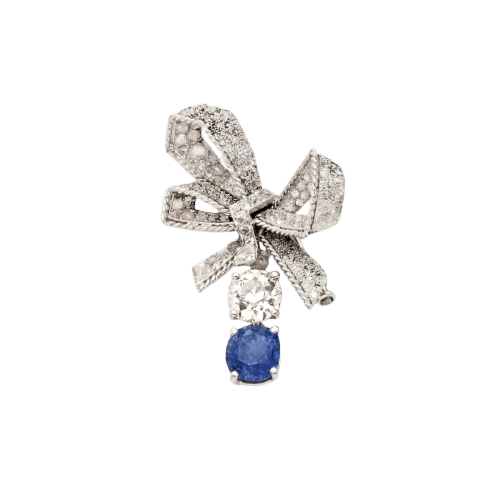 Broche Broche nœud en platine et or blanc, saphir de Ceylan et diamants 58 Facettes SKU: 22871