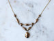 Collier Collier draperie ancien en or rose et or jaune, grenats de Perpignan 58 Facettes