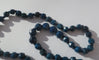 Collier Collier en chute en pierres bleues naturelles et fermoir or rose émaillé 58 Facettes Collier